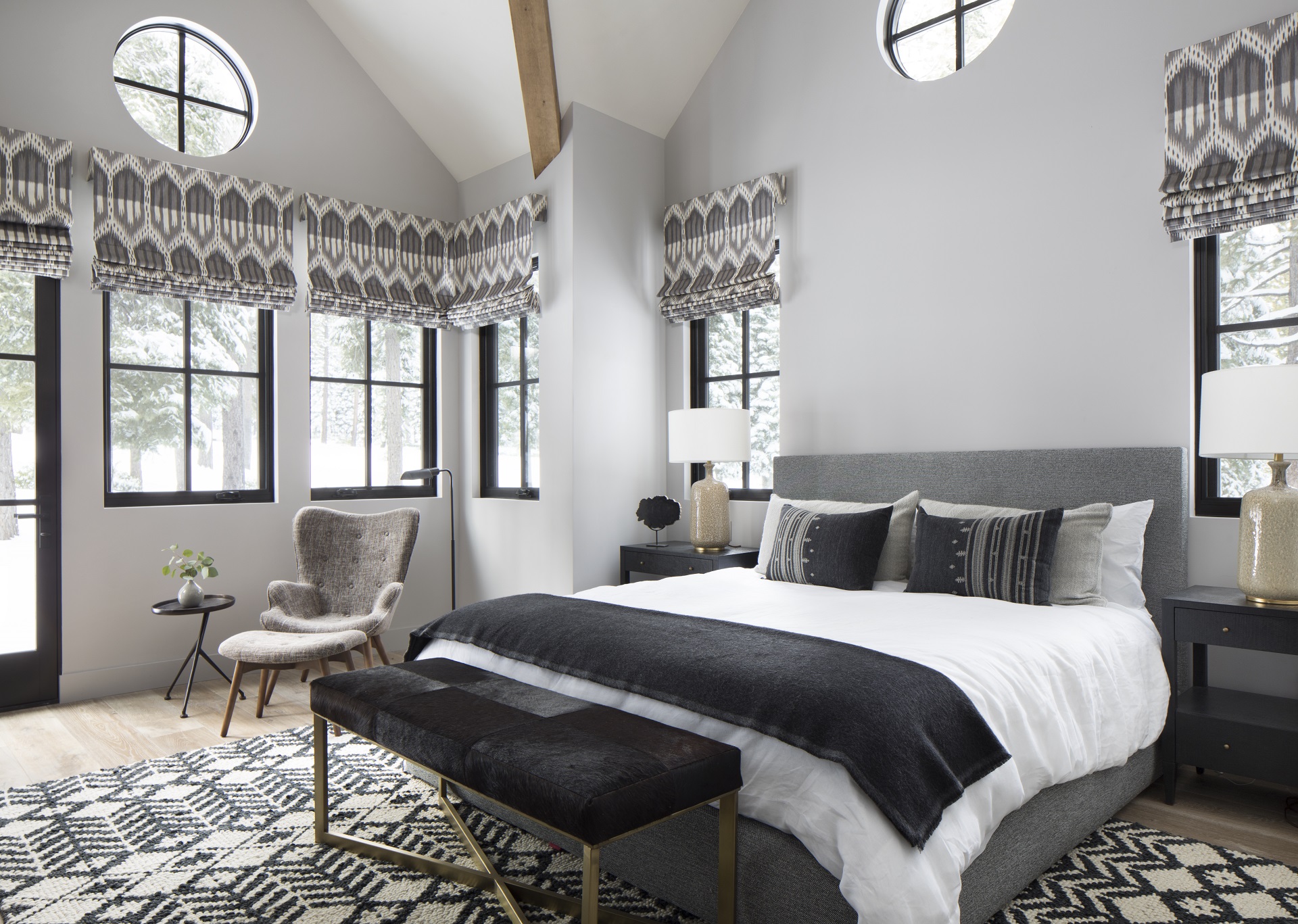 Shades of grey bedroom with roman shades