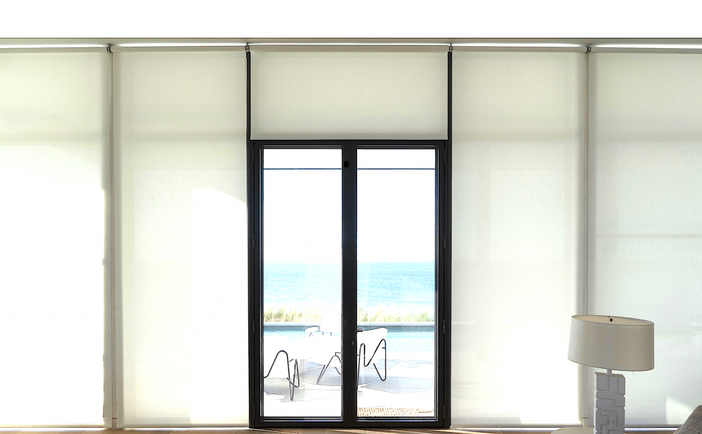 Wall of windows with roller shades