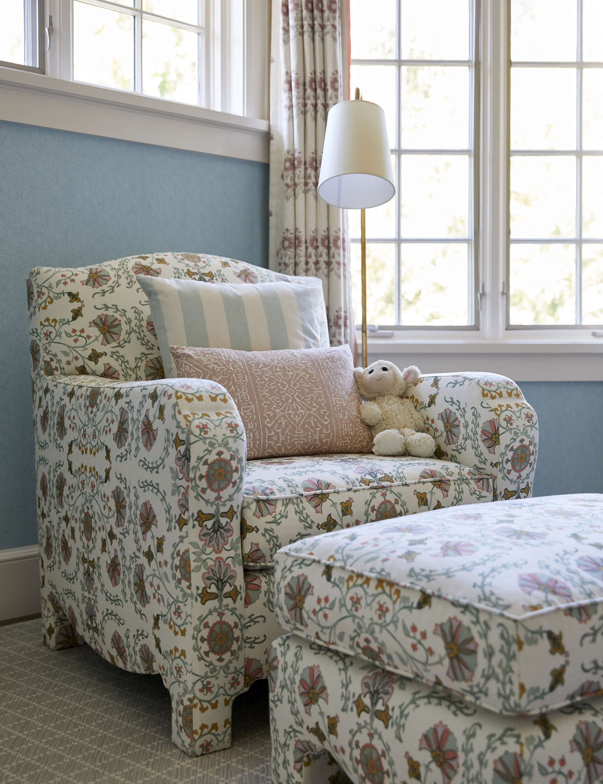 Floral pattern armchair and matching ottoman