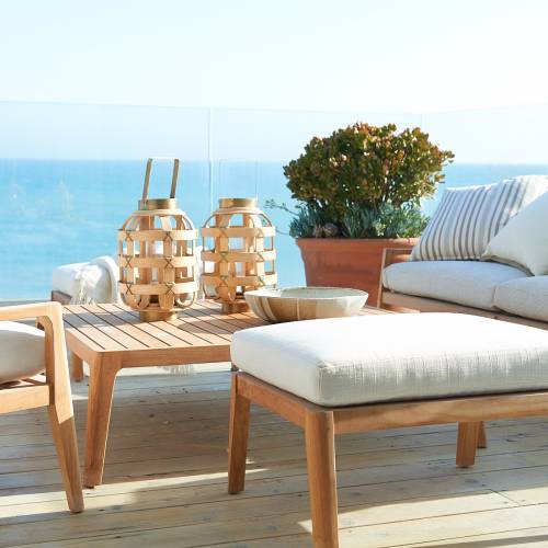 Outdoor patio set with cream-colored cushions